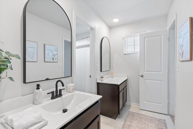 5833 Bianca Dr, Round Rock, TX 78665 - full bathroom featuring two vanities and tile patterned floors