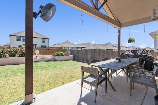 view of patio with a residential view, outdoor dining area, and a fenced backyard