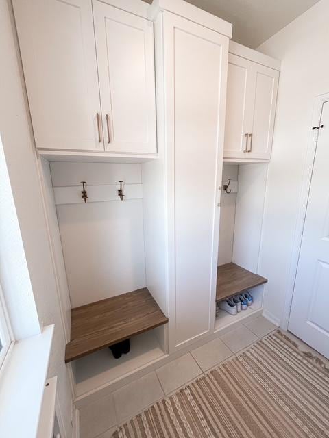 mudroom with light tile patterned floors