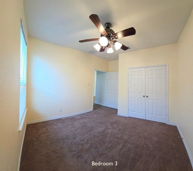 unfurnished bedroom with a ceiling fan, carpet, a closet, and baseboards