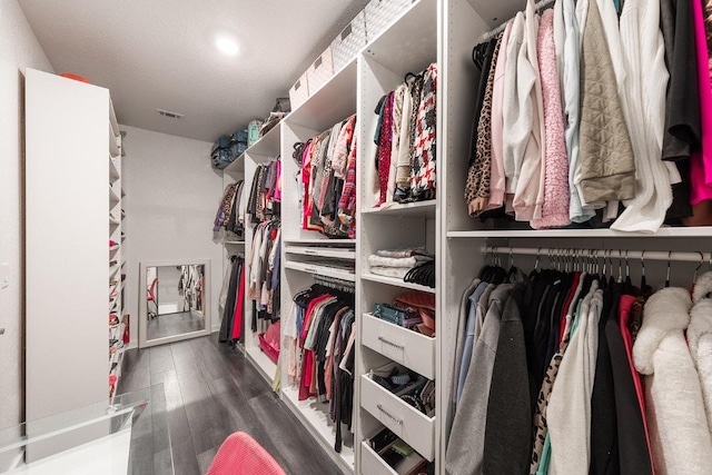 2233 Bravo Pass, Leander, TX 78641 - walk in closet featuring wood finished floors