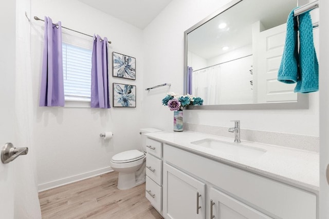 2233 Bravo Pass, Leander, TX 78641 - full bathroom featuring vanity, baseboards, wood finished floors, toilet, and a shower with curtain