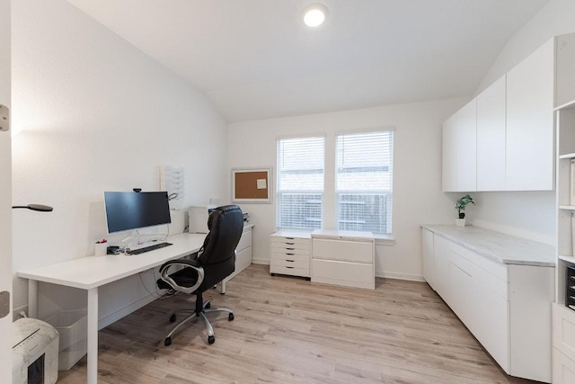 2233 Bravo Pass, Leander, TX 78641 - home office featuring lofted ceiling, light wood finished floors, and baseboards