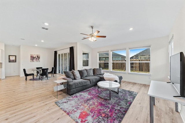 2233 Bravo Pass, Leander, TX 78641 - living room featuring light wood-style floors, ceiling fan, recessed lighting, and baseboards