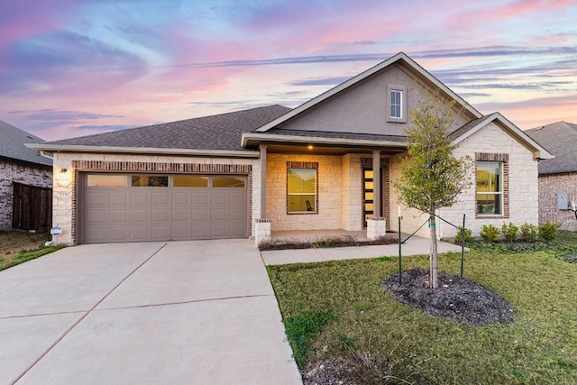 2233 Bravo Pass, Leander, TX 78641 - view of front facade with concrete driveway, an attached garage, a front yard, and roof with shingles