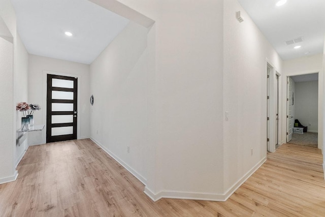 2233 Bravo Pass, Leander, TX 78641 - entryway with light wood-style floors, baseboards, and recessed lighting