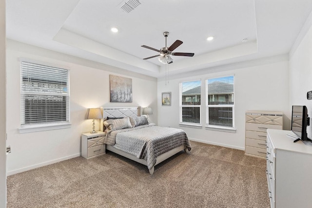 2233 Bravo Pass, Leander, TX 78641 - bedroom featuring a raised ceiling, light carpet, baseboards, recessed lighting, and a ceiling fan