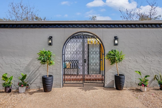 910 Old Stonehedge St, Austin, TX 78746 - view of exterior entry with stucco siding