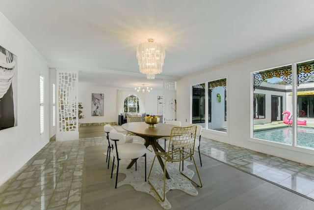 910 Old Stonehedge St, Austin, TX 78746 - dining area featuring a chandelier, crown molding, and baseboards