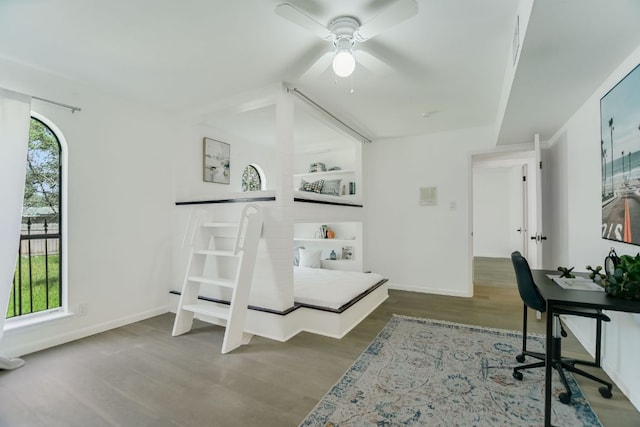 910 Old Stonehedge St, Austin, TX 78746 - office space featuring wood finished floors, a ceiling fan, and baseboards