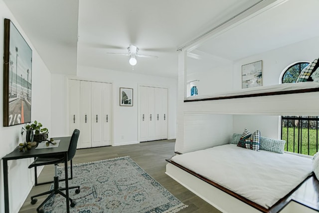 910 Old Stonehedge St, Austin, TX 78746 - bedroom with two closets, wood finished floors, ceiling fan, and baseboards