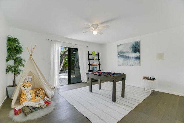 910 Old Stonehedge St, Austin, TX 78746 - game room featuring a ceiling fan, wood finished floors, and baseboards