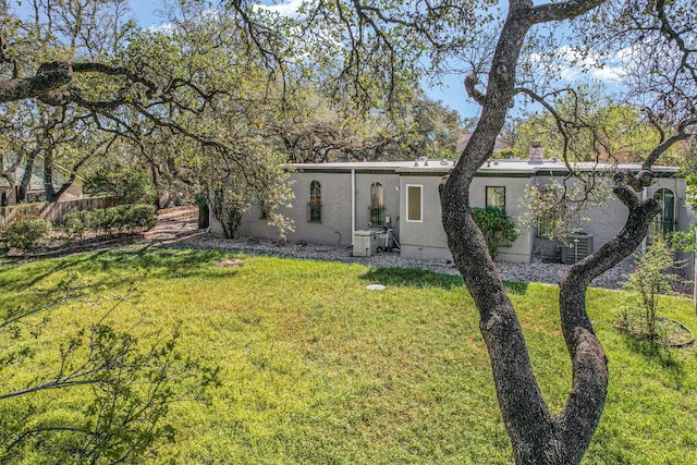 910 Old Stonehedge St, Austin, TX 78746 - view of front of house with stucco siding and cooling unit