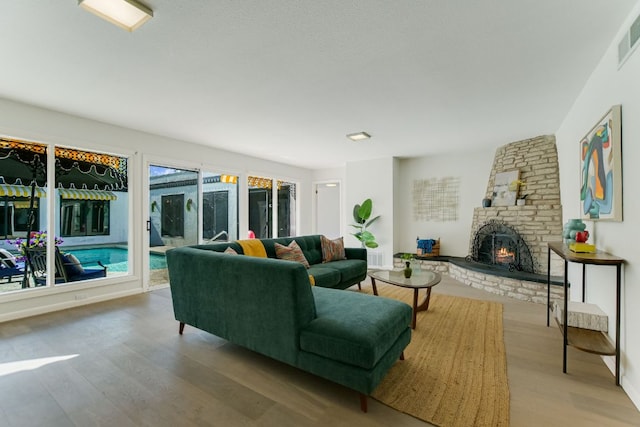 910 Old Stonehedge St, Austin, TX 78746 - living area with wood finished floors and a fireplace