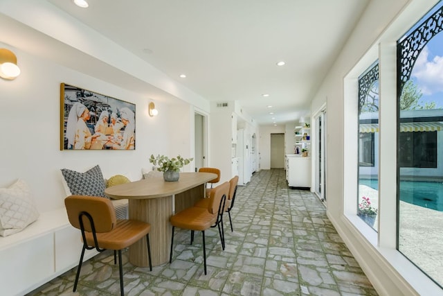 910 Old Stonehedge St, Austin, TX 78746 - dining space featuring stone finish floors and recessed lighting