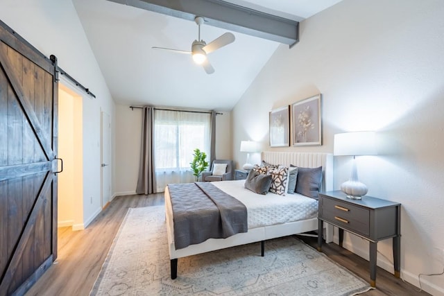 12303 Bainbridge Ln, Austin, TX 78750 - bedroom featuring a barn door, beamed ceiling, light wood-style floors, baseboards, and high vaulted ceiling