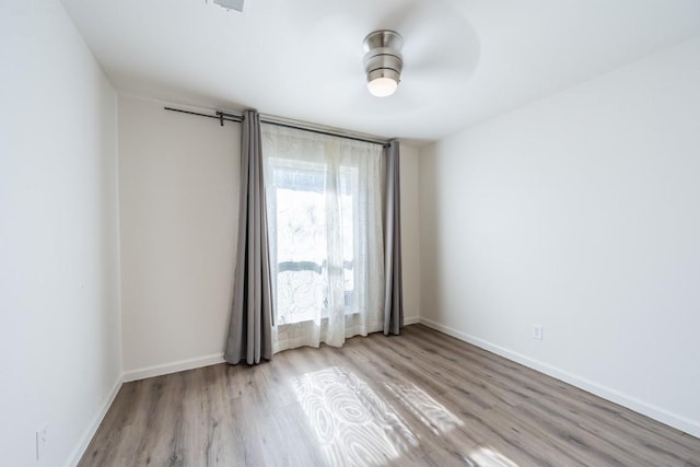 12303 Bainbridge Ln, Austin, TX 78750 - spare room with wood finished floors and baseboards