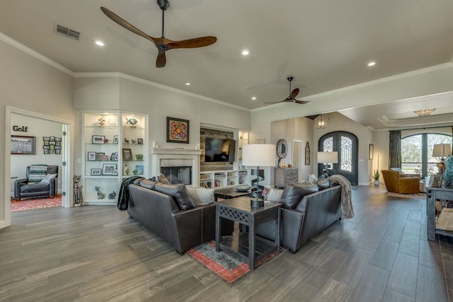 3012 Driftwood Ln, Horseshoe Bay, TX 78657 - living room featuring ceiling fan, wood finished floors, a fireplace, recessed lighting, and crown molding