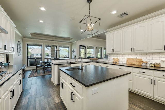 3012 Driftwood Ln, Horseshoe Bay, TX 78657 - kitchen featuring a chandelier, appliances with stainless steel finishes, a peninsula, recessed lighting, and crown molding
