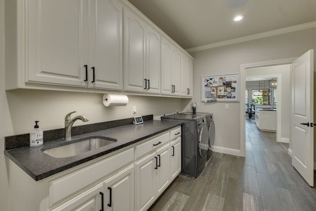 3012 Driftwood Ln, Horseshoe Bay, TX 78657 - washroom with cabinet space, washing machine and dryer, crown molding, dark wood finished floors, and recessed lighting