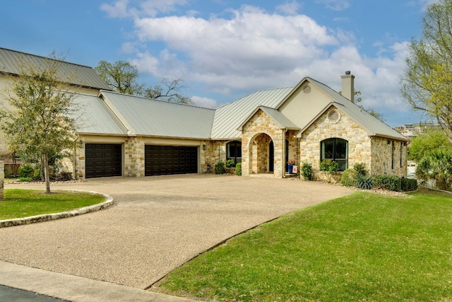 3012 Driftwood Ln, Horseshoe Bay, TX 78657 - view of front facade featuring a garage, stone siding, a chimney, and a front yard