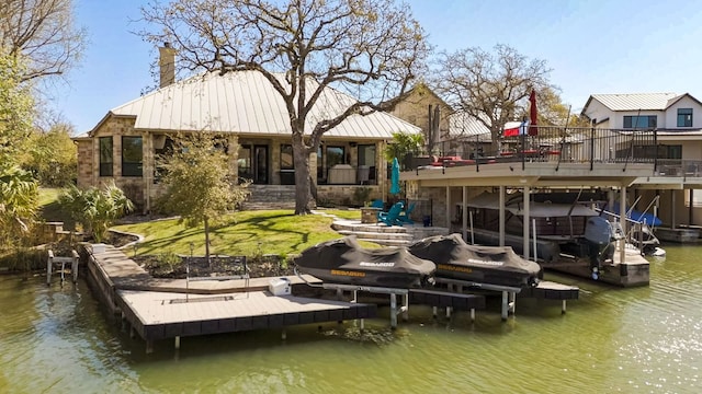 3012 Driftwood Ln, Horseshoe Bay, TX 78657 - dock featuring boat lift and a deck with water view