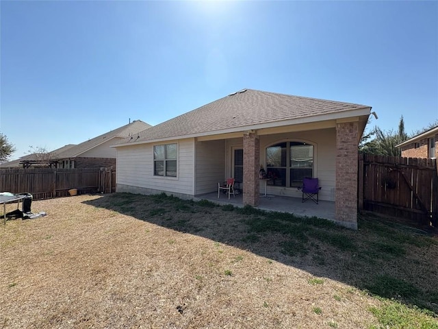2316 Dovetail St, Pflugerville, TX 78660 - back of house featuring a fenced backyard and a patio