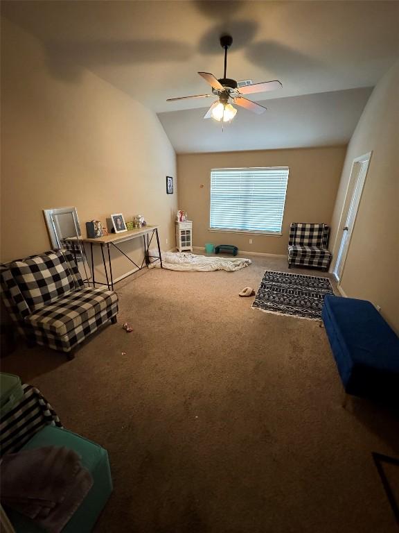 2316 Dovetail St, Pflugerville, TX 78660 - living area featuring carpet flooring, a ceiling fan, and vaulted ceiling