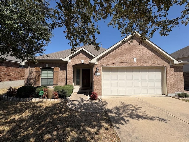 2316 Dovetail St, Pflugerville, TX 78660 - single story home with an attached garage, brick siding, driveway, and roof with shingles