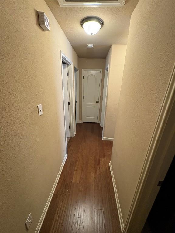 2316 Dovetail St, Pflugerville, TX 78660 - hall featuring dark wood-style flooring and a textured wall