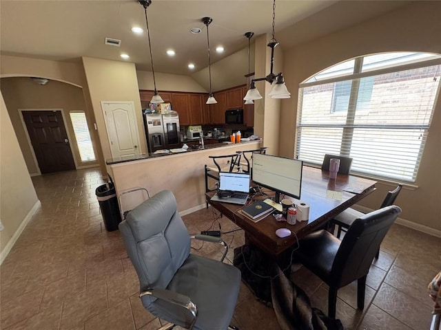 2316 Dovetail St, Pflugerville, TX 78660 - dining room featuring recessed lighting, arched walkways, vaulted ceiling, and a desk