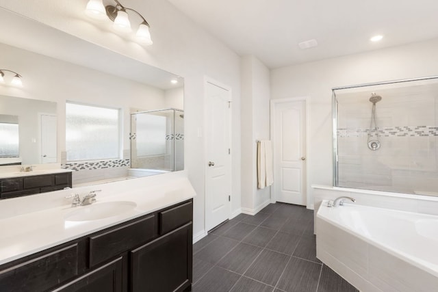 277 Biscayne Bay Bnd, Kyle, TX 78640 - bathroom featuring a stall shower, a bath, vanity, healthy amount of natural light, and recessed lighting