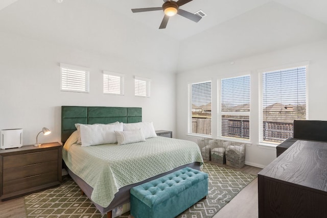 277 Biscayne Bay Bnd, Kyle, TX 78640 - bedroom featuring wood finished floors, multiple windows, lofted ceiling, and ceiling fan