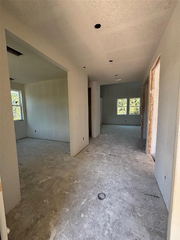 20110 Lee Ln, Lago Vista, TX 78645 - interior space featuring plenty of natural light, visible vents, and a textured ceiling