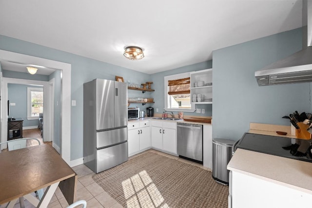 1407 S Myrtle St, Georgetown, TX 78626 - kitchen with appliances with stainless steel finishes, open shelves, a sink, and plenty of natural light