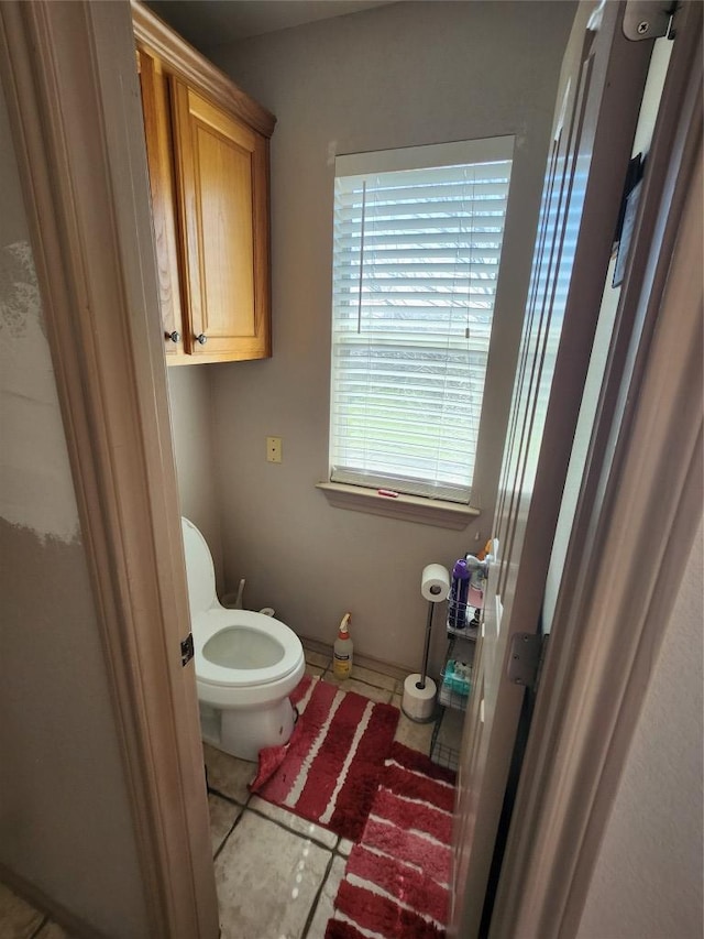 bathroom featuring tile patterned flooring and toilet