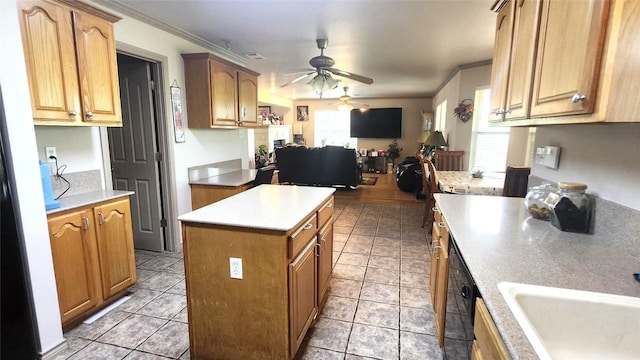 1149 State Highway 21 W Unit A, Cedar Creek, TX 78612 - kitchen featuring open floor plan, ceiling fan, a center island, a sink, and ornamental molding