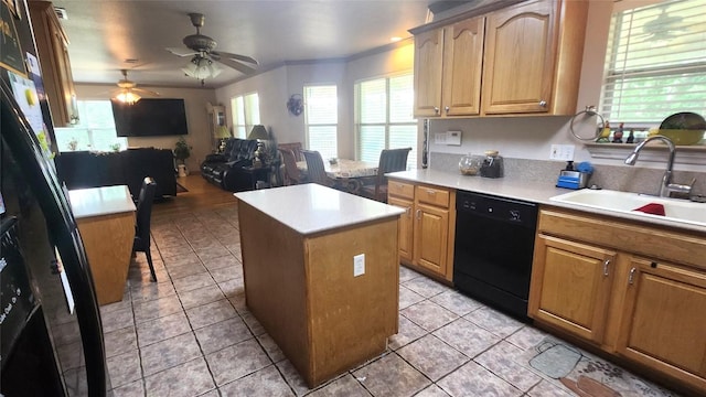1149 State Highway 21 W Unit A, Cedar Creek, TX 78612 - kitchen with dishwasher, a sink, a kitchen island, light countertops, and a ceiling fan