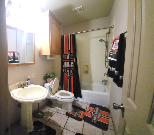 1149 State Highway 21 W Unit A, Cedar Creek, TX 78612 - full bathroom featuring tile patterned flooring, toilet, shower / tub combo with curtain, and a sink