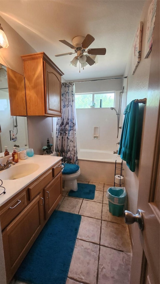 1149 State Highway 21 W Unit A, Cedar Creek, TX 78612 - bathroom featuring toilet, vanity, tile patterned flooring, ceiling fan, and shower / bath combination with curtain