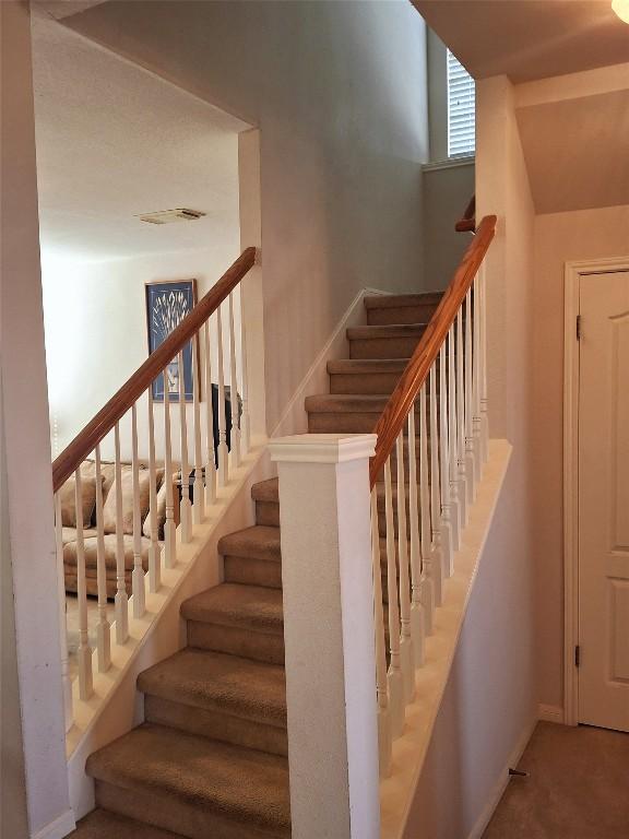 1709 Camas Dr, Austin, TX 78728 - stairs with baseboards