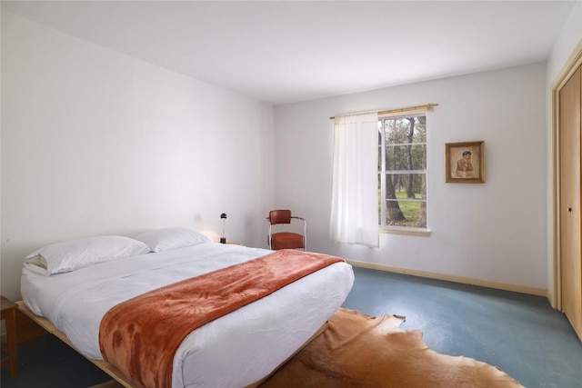 305 Reimer Ave, San Marcos, TX 78666 - bedroom with baseboards and concrete floors