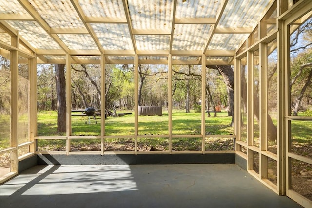 305 Reimer Ave, San Marcos, TX 78666 - unfurnished sunroom with view of wooded area