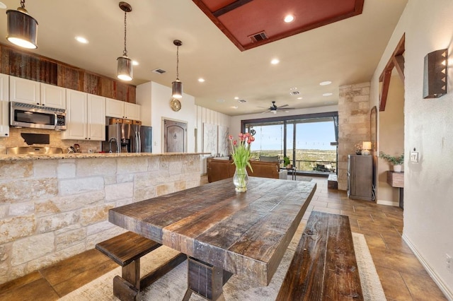 dining area featuring a ceiling fan, recessed lighting, baseboards, and visible vents