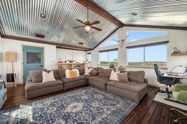 living area with wood-type flooring, baseboards, a ceiling fan, and vaulted ceiling with beams
