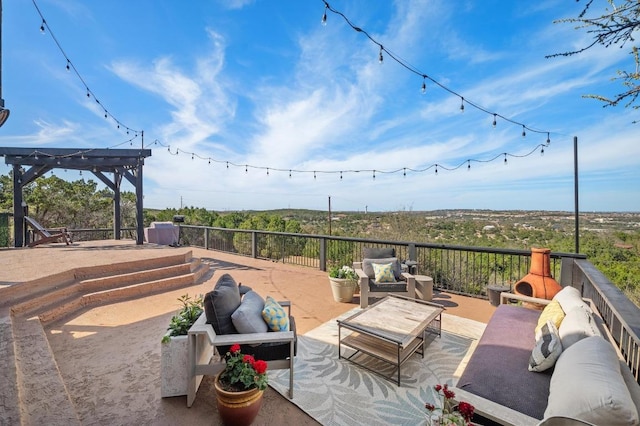 view of patio featuring a pergola and an outdoor living space