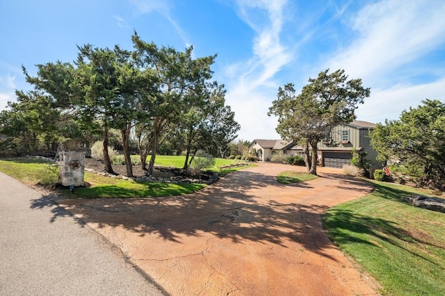 view of road featuring aphalt driveway