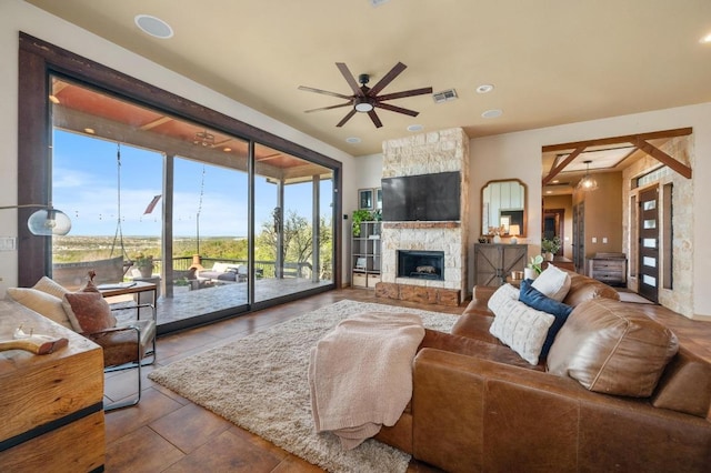 living room featuring visible vents, a fireplace, a ceiling fan, and recessed lighting