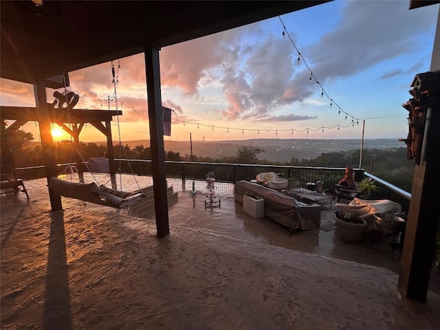 view of patio terrace at dusk