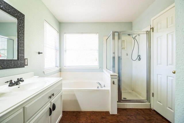 12316 Sugar Leaf Pl, Austin, TX 78748 - full bath with a shower stall, vanity, a bath, and wood finished floors